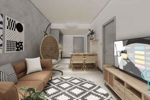 A modern living room with a sofa, TV, and dining area.