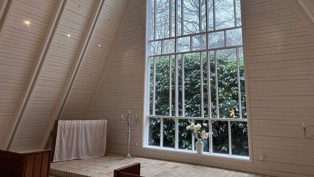 A room with a large window, sloped ceiling, and a wooden floor. - Holiday Home for 2 in Stenungsund (Stenungsund)