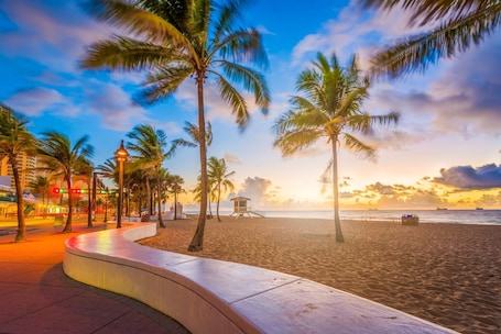 On the beach, beach towels. Modern Studio: King Bed & Full Kitchen - 5-Min to Beach