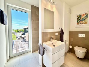 Shower, hair dryer, towels
