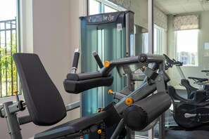 A gym with exercise equipment, a treadmill, and a stationary bike. - 5BR to Gather, Relax and Make Memories (2640ST) (Kissimmee)