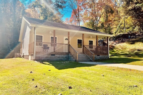 This adorable home is perfect for two couples or a small family. There is plenty of parking and a huge yard for the kids to enjoy. A small creek runs behind the home and provides a very relaxing atmosphere while sitting on the back porch.