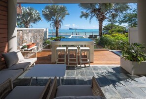 Outdoor dining - Luxury beachfront duplex, Coin de Mire view / 3Bed (Cap Malheureux)