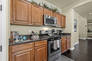 Coffee/tea maker, fridge, microwave, oven