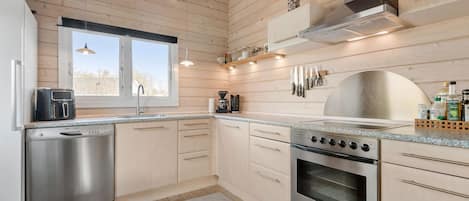 Fridge, stovetop, dishwasher, coffee/tea maker