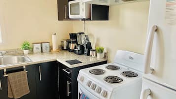 Microwave, coffee/tea maker, blender, cookware/dishes/utensils