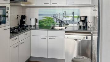 Fridge, stovetop, dishwasher, coffee/tea maker