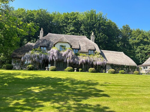Country farmhouse surrounded by lakes green fields with private spa