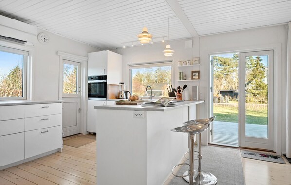 Fridge, stovetop, dishwasher, coffee/tea maker