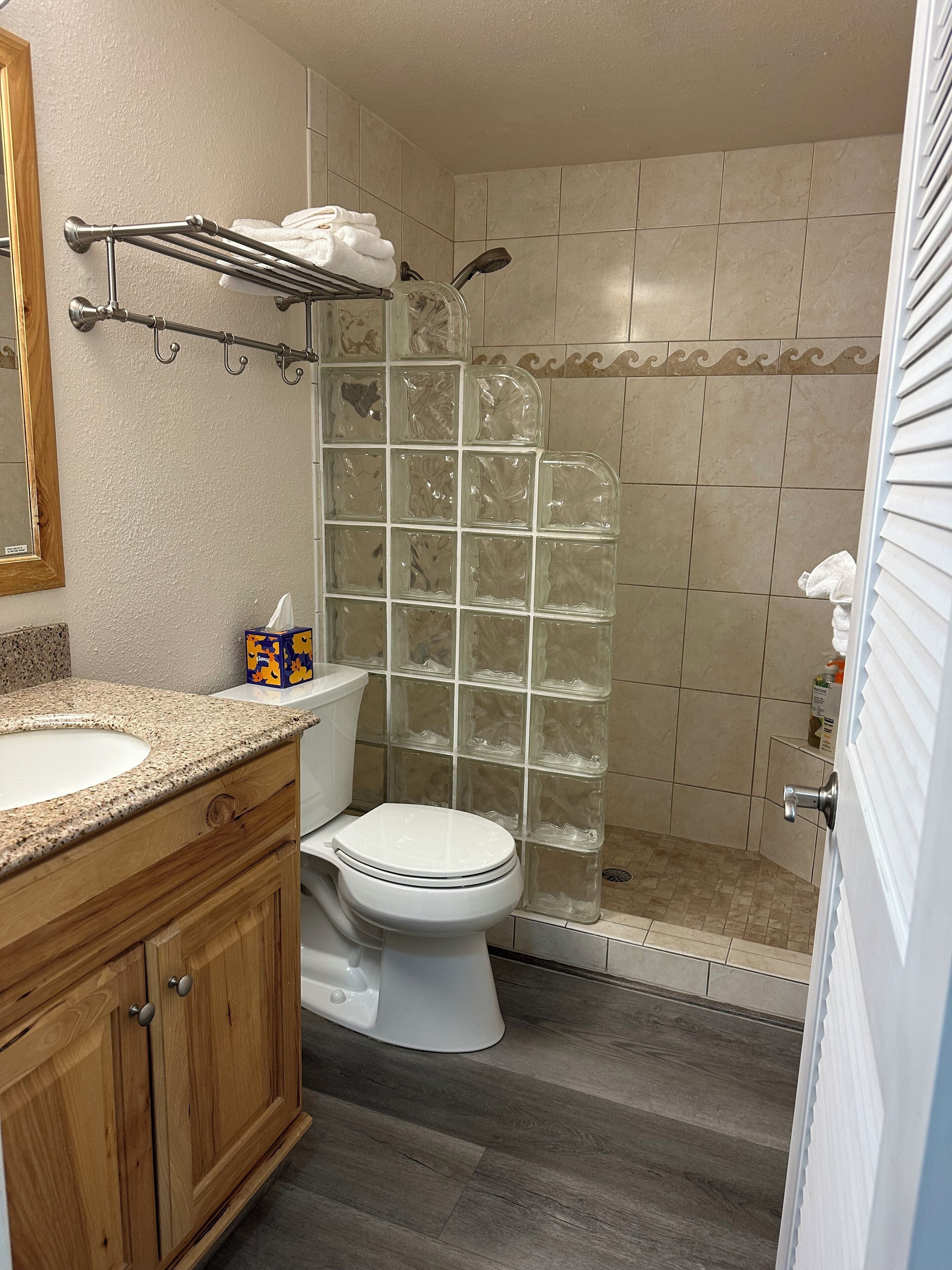 Shower, hair dryer, towels, soap