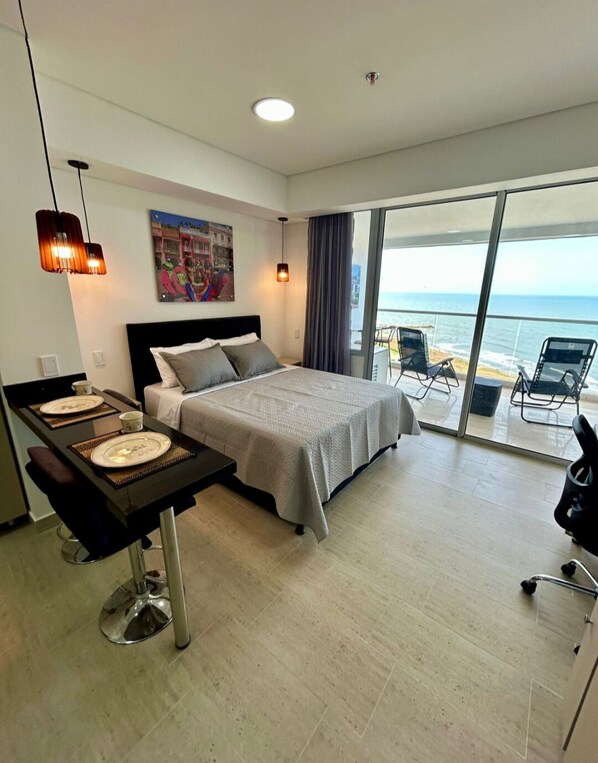 Comfort Studio, Balcony, Beach View | In-room safe, desk, blackout curtains, iron/ironing board