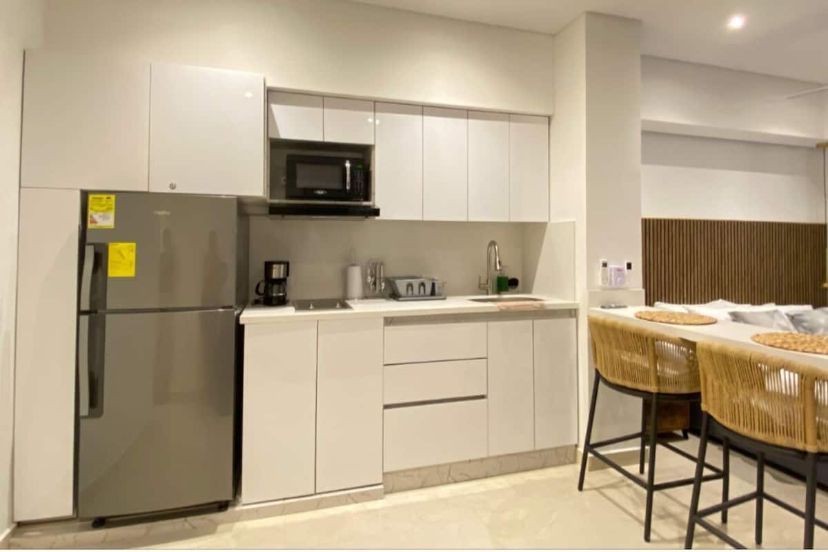 Mini-fridge, microwave, cookware/dishes/utensils