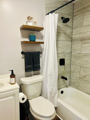 Shower, hair dryer, towels, soap