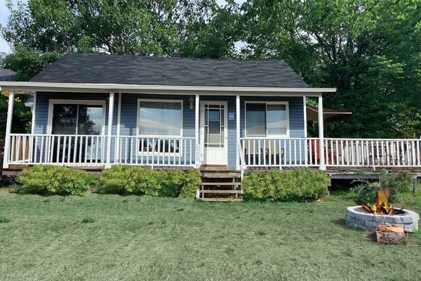 Rustic Cabin with fire pit in front