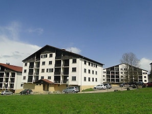 Residents enjoy balconies and convenient parking in this apartment complex.