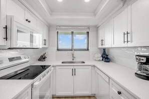 Fridge, microwave, oven, stovetop - 🌅 Top-Floor Ocean View 1BR | Updated | Private Balcony & Beachfront Pool (New Smyrna Beach)