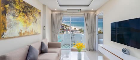 Apartamento família, 2 quartos, vista para a praia | Área de estar