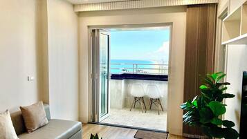 Family Apartment, 2 Bedrooms, Beach View | Desk, laptop workspace, blackout curtains, iron/ironing board