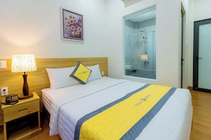 Habitación individual Deluxe, vistas al jardín | Minibar (con algunos artículos gratuitos), wifi gratis, ropa de cama