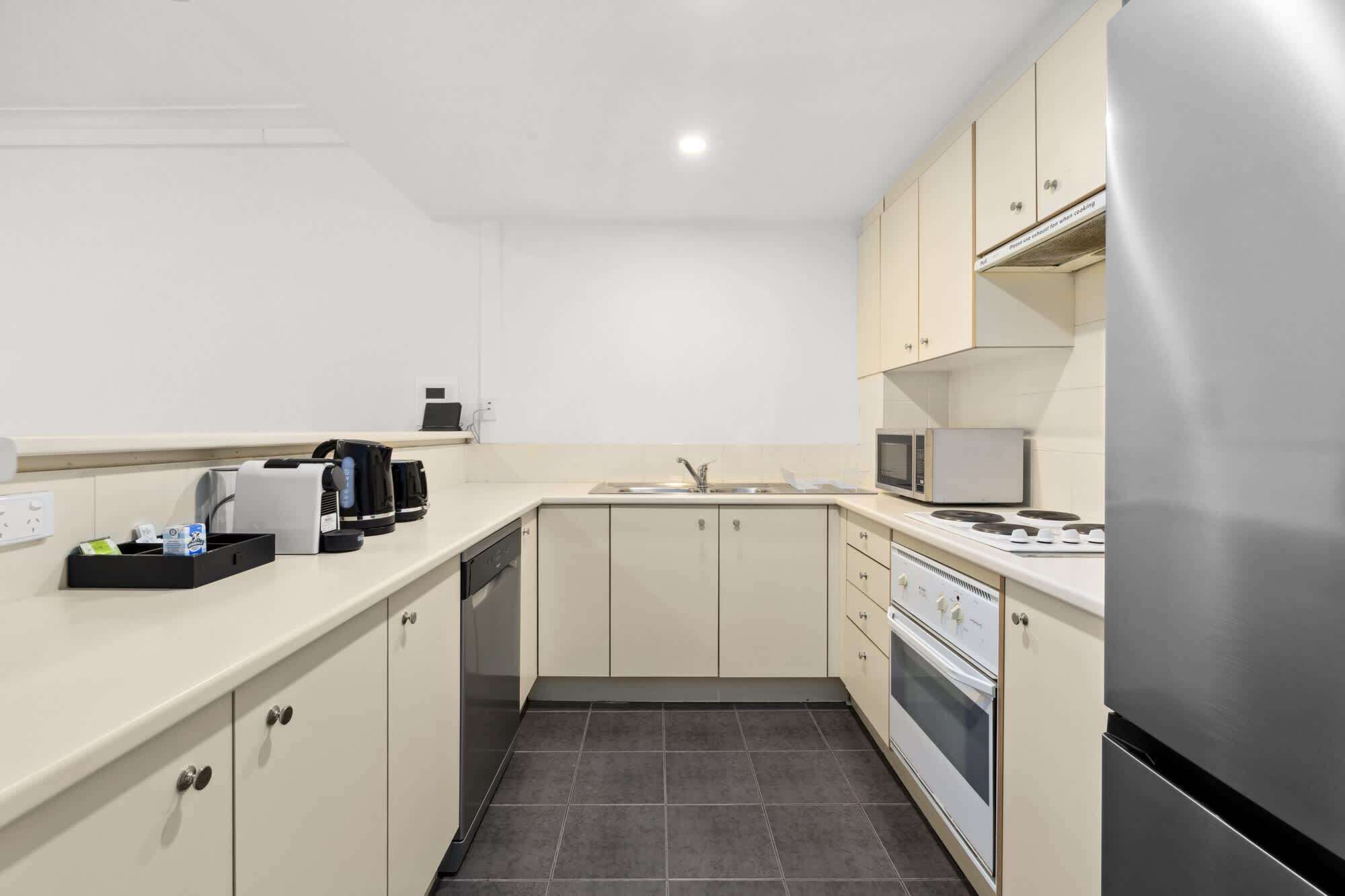 Coffee/tea maker, fridge, microwave, oven