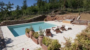 A swimming pool with lounge chairs and potted plants. - Relais La Costa by Interhome (Monteriggioni)