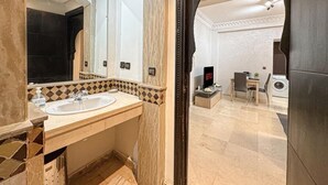 A modern bathroom with a large mirror, two sinks, and a shower area. - Bewitchment in Marrakech: A haven of peace in Guéliz, close to Carré Éden (Marrakech)