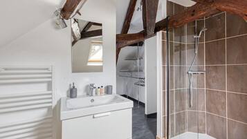 Shower, towels, soap, toilet paper