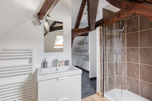 Shower, towels, soap, toilet paper