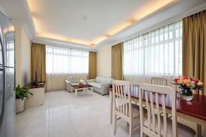 Basic Apartment, 1 Bedroom | Living area | 32-inch LCD TV with cable channels, DVD player