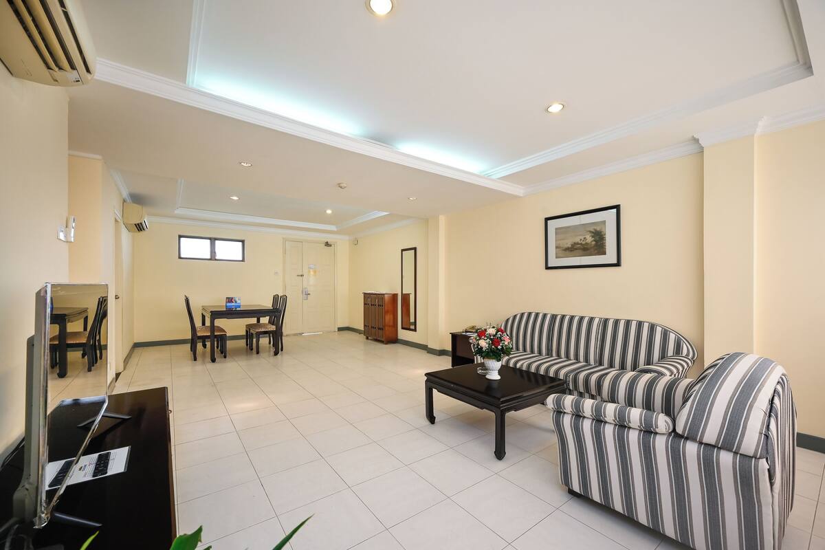 Family Apartment | Living area | 32-inch LCD TV with cable channels, DVD player