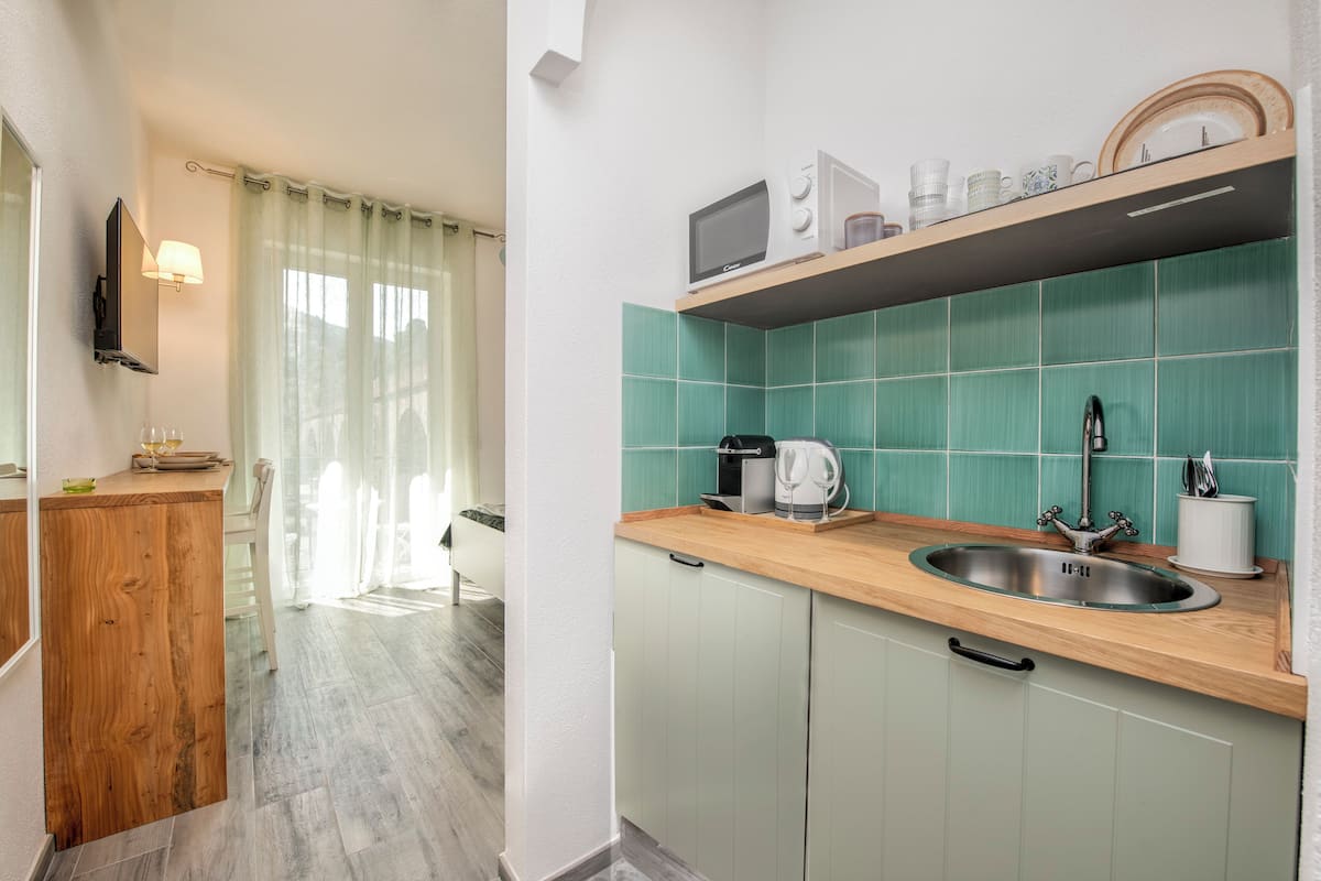 Superior Room, Kitchenette | 1 bedroom, blackout drapes, iron/ironing board, free WiFi