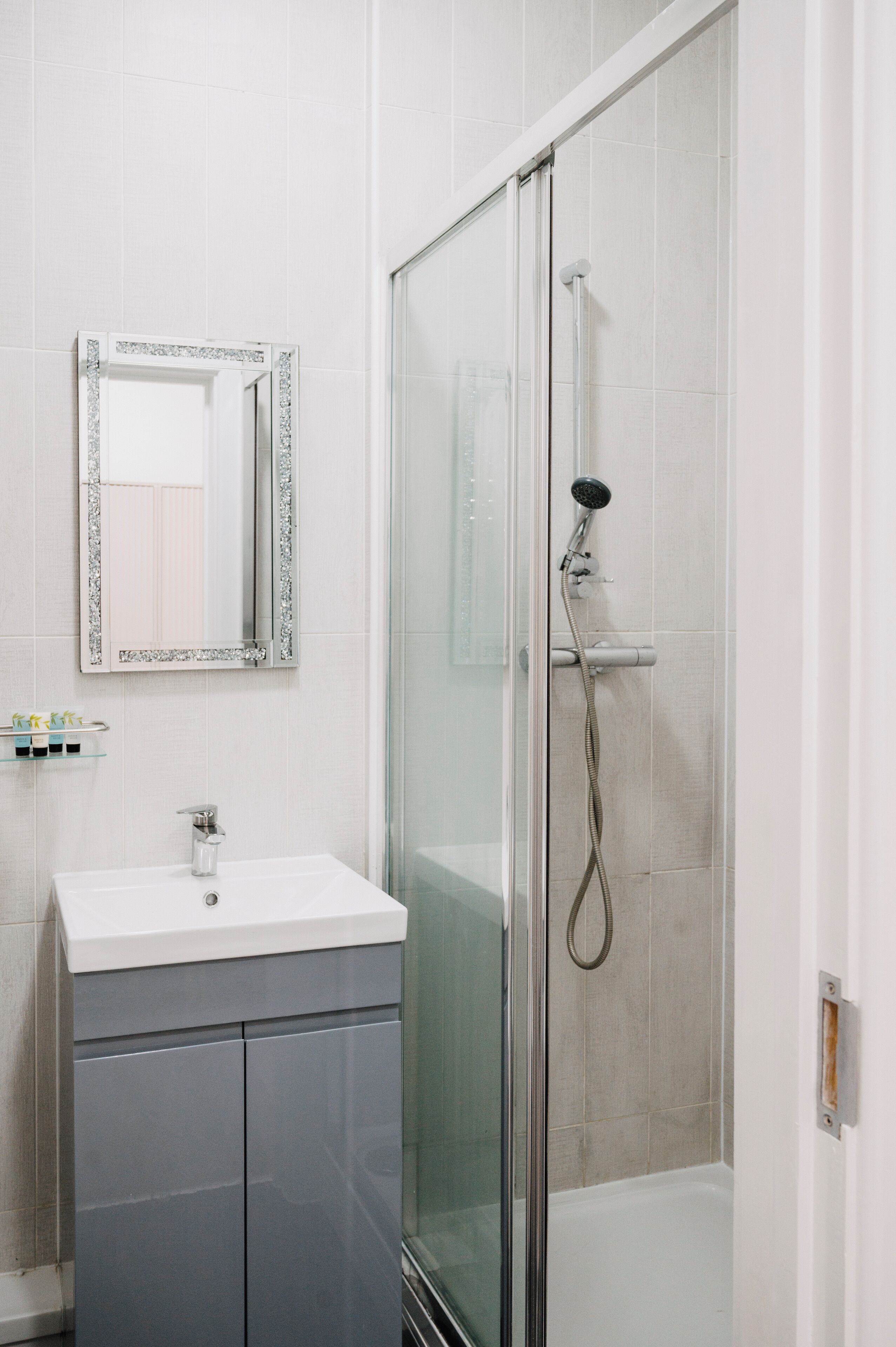 Shower, hair dryer, towels, soap