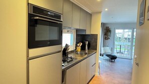 Fridge, dishwasher, toaster, dining tables