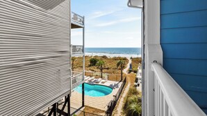 A balcony with a pool, overlooking the beach and ocean. - 10% off 3-7 nights thru Dec. 2BR 2BA oceanVIEW condo Cherry Grove. Peaceful area (North Myrtle Beach)