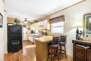 Dishwasher, coffee/tea maker, cookware/dishes/utensils, dining tables