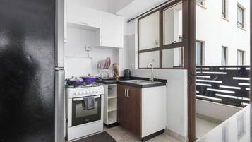 Fridge, microwave, stovetop, coffee/tea maker