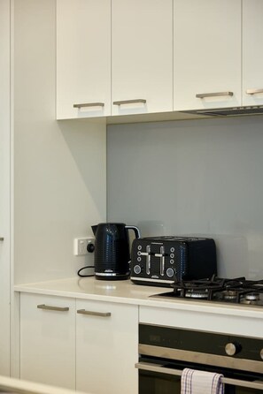 Fridge, oven, coffee/tea maker, dining tables