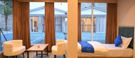 Honeymoon Cottage, Balcony, Pool View | Living area