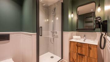 Shower, hair dryer, towels, soap