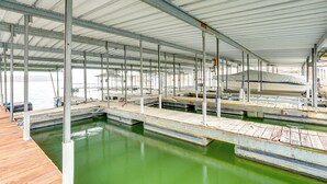 A covered marina with multiple docks and boats. - Private Boat Dock: Lakefront Cabin in Camdenton (Camdenton)