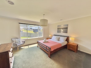 Master bedroom with walk in robe and bathroom