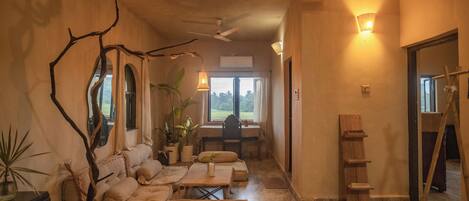 Quarto premium | Área de estar