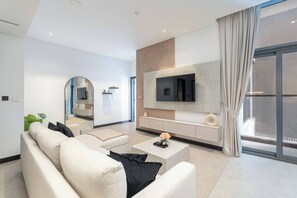 Living room - Spacious 1bedroom, Burj Views, Infinity Pool & Jacuzzi (Dubai)