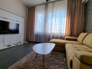 Apartamento, 1 quarto | Sala de estar