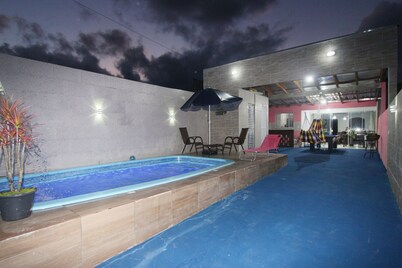 I rent a beach house with a swimming pool, air conditioning, pool table and sauna.