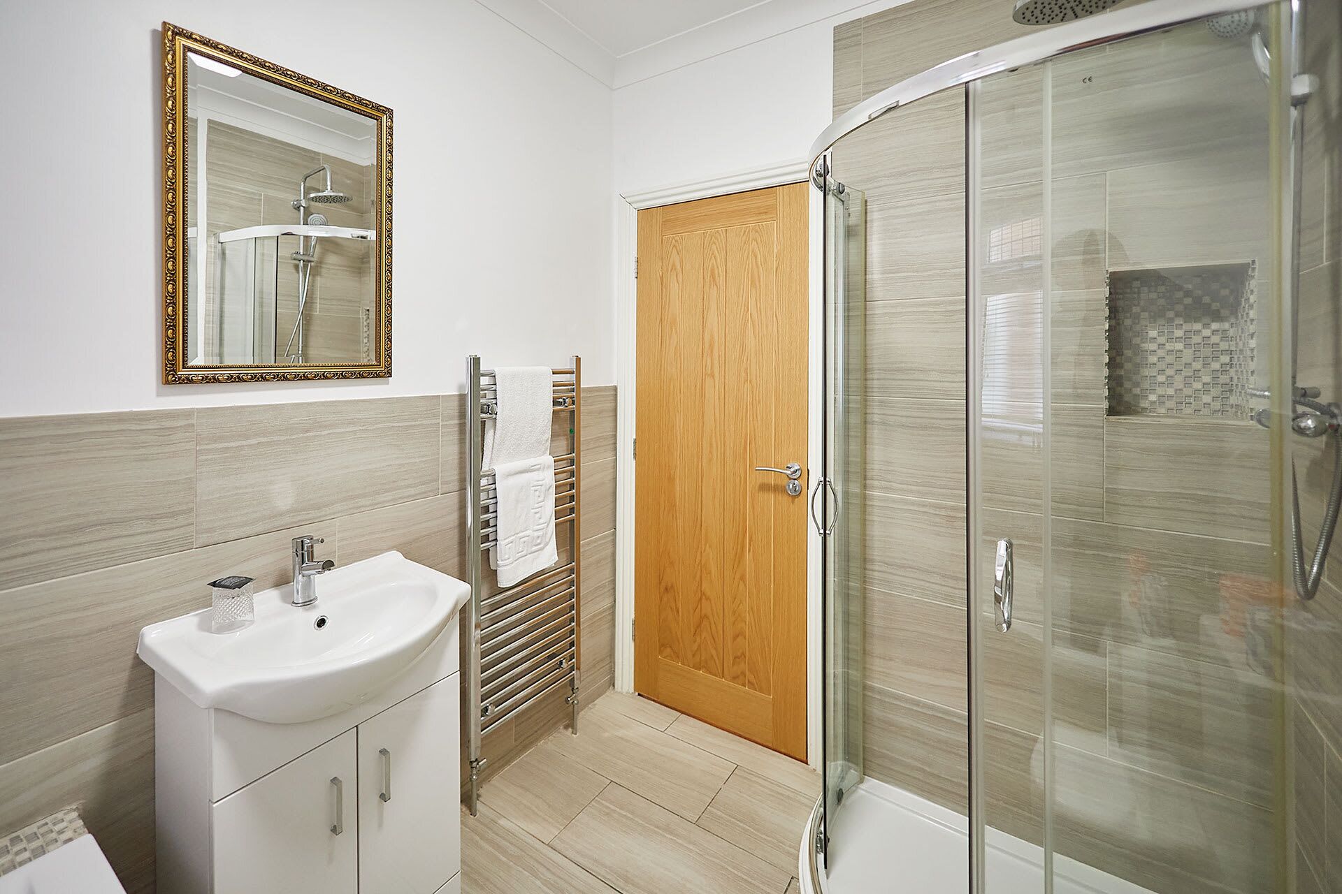 Shower, hair dryer, towels, shampoo