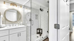 Shower, hair dryer, towels, shampoo