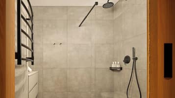 Ein modernes Badezimmer mit Dusche, Toilette und Handtuchhalter.