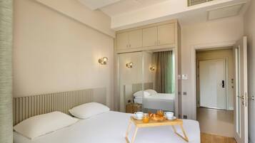 1 bedroom, desk, iron/ironing board, travel crib