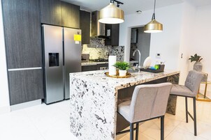 City Apartment, 1 Queen Bed (E2) | Private kitchen | Full-size fridge, microwave, oven, stovetop